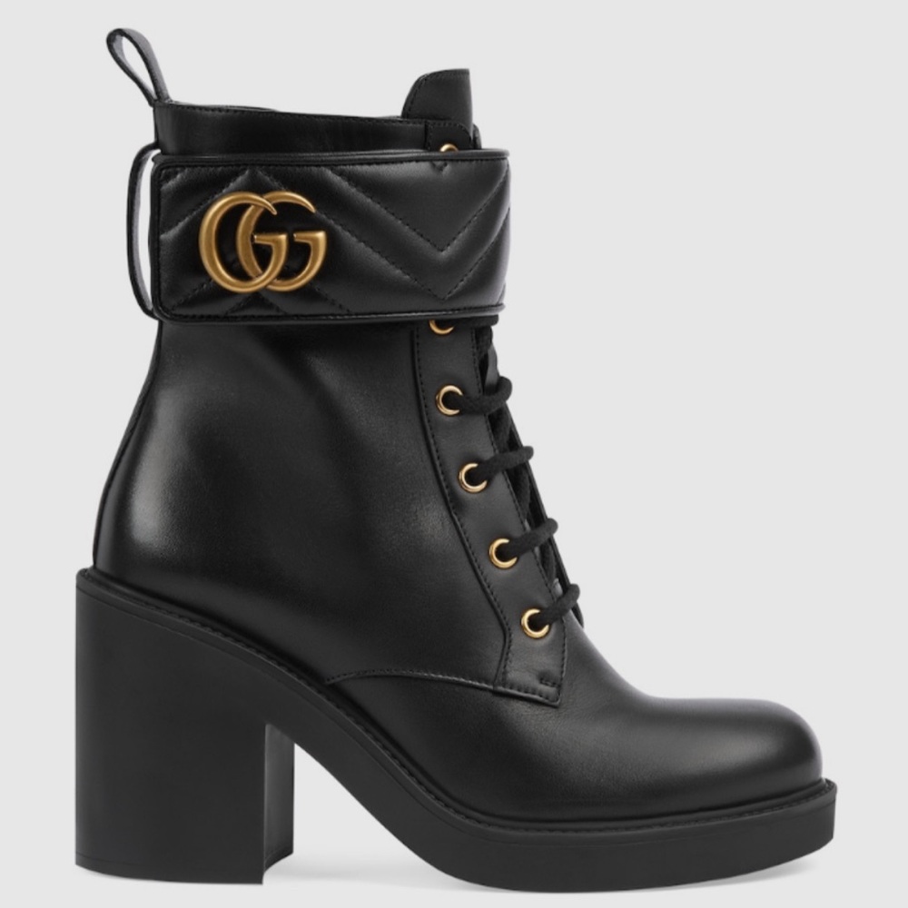 Authentic Black women’s Gucci ankle boot with Gold GG logo hardware